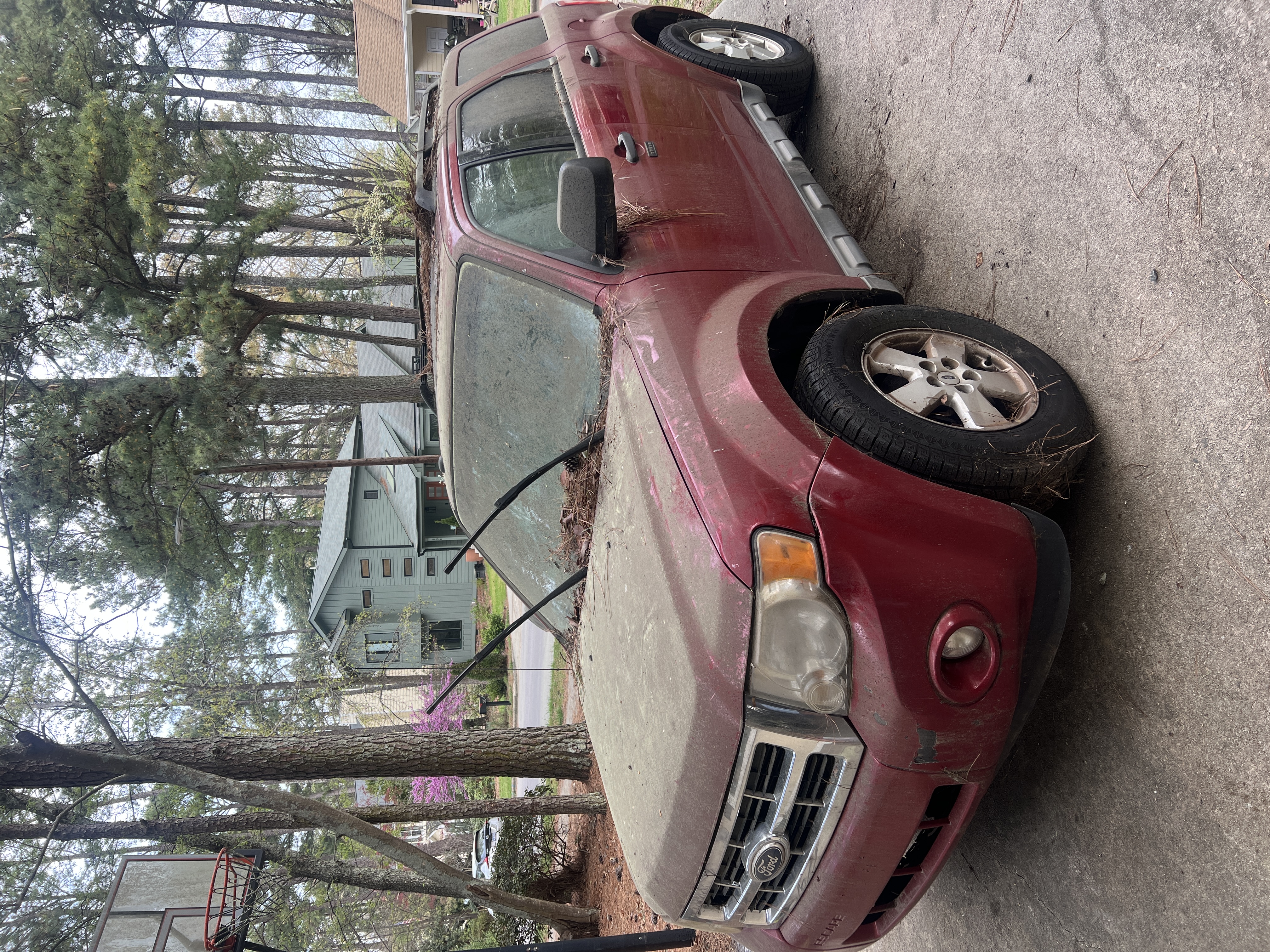 Maroon Nissan Xterra before detailing